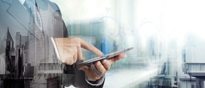 Image of a businessman working on a computer tablet 