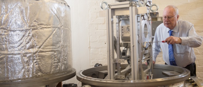 Professor James Hough with gravitational waves machinery