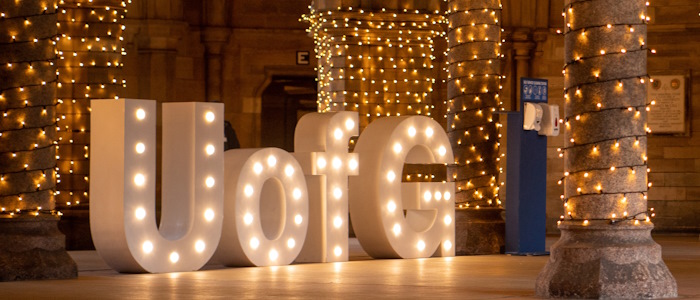 UofG letter sign lit up i the undercroft during graduation