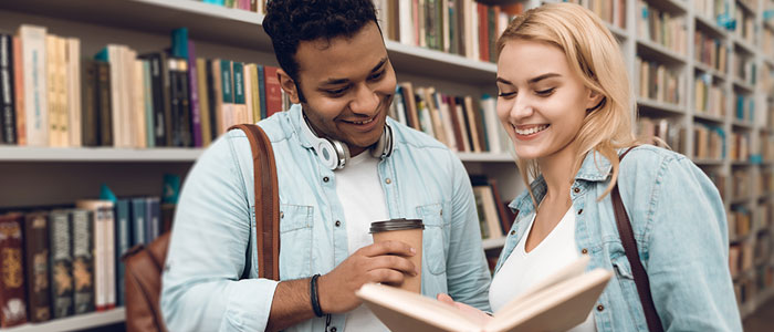Image of 2 students in library