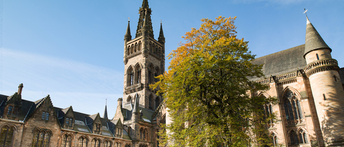 Photo of University of Glasgow main building against blue sky