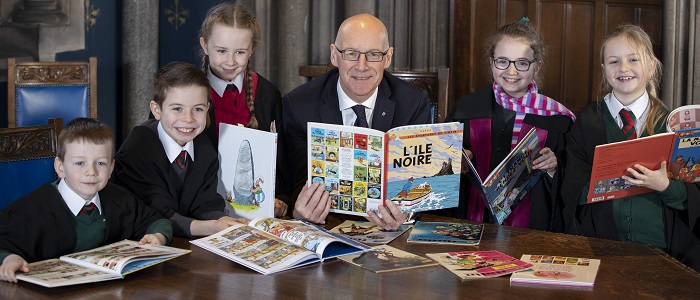 Pupils from St Patrick's Primary joins Deputy First Minister John Swinney to launch new education resources created from UofG researcher. 