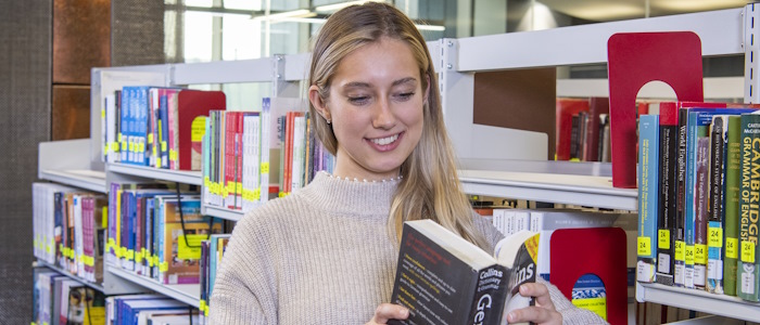 A language student looking at a language book