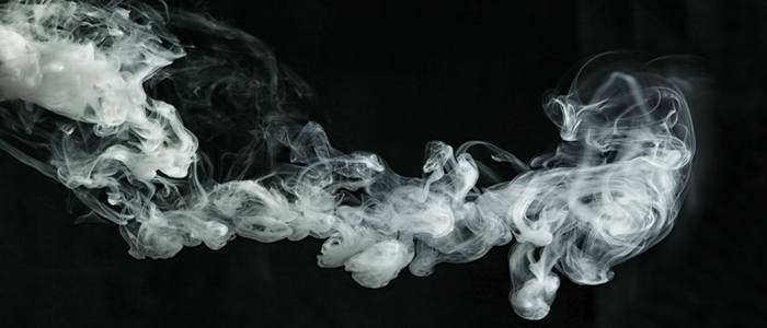 Image of smoke drifting across a black background