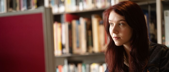 Female student in library at computer