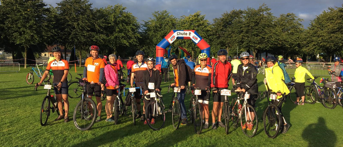 Photo of staff and students participating in charity cycle rid