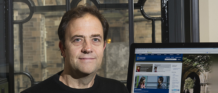 Profile photo of Professor Andrew Cumbers in his office