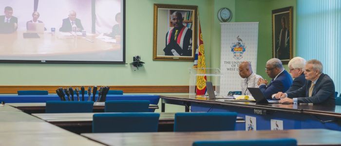 Staff from UWI and UofG in a board meeting