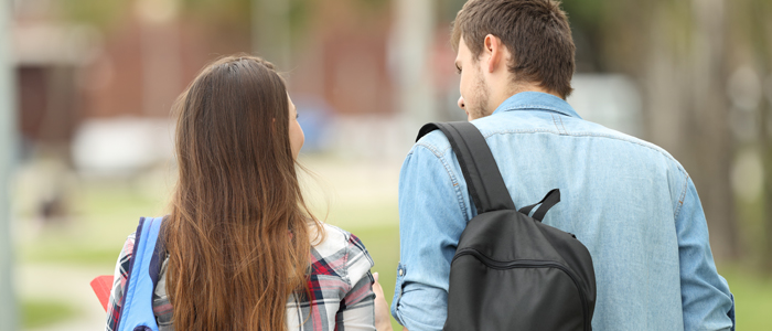 Photo of young people walking in a park