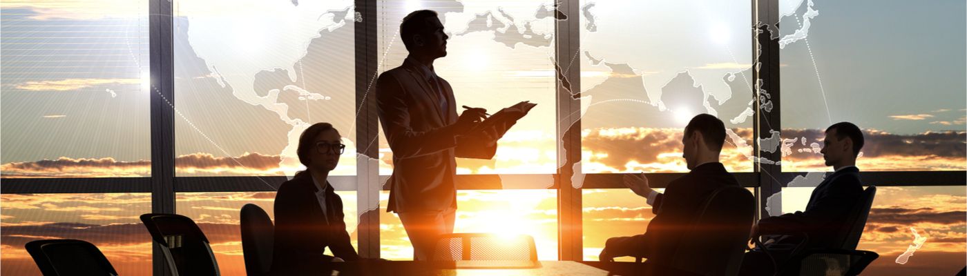Image of four business people in a boardroom