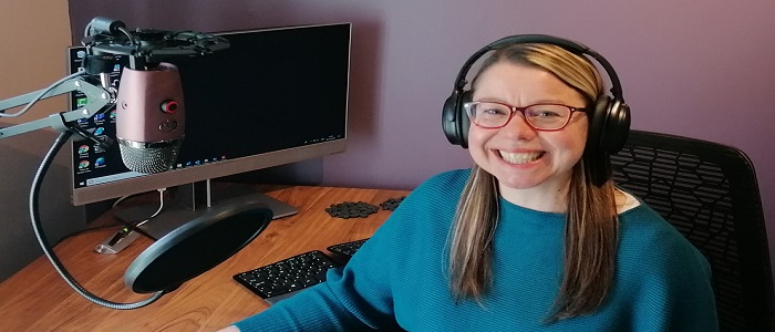 Image of Sharon Wright sitting at her computer
