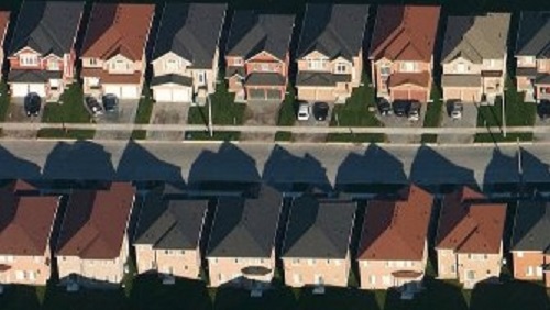 Two rows of house seen from above the roofs