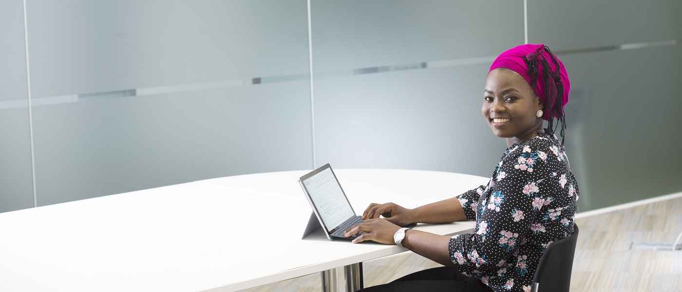 Academic working at laptop in the School of Computing Scinece