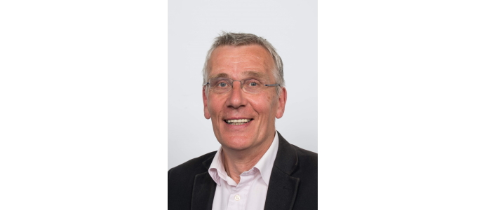 Portrait image of Professor Jim Tomlinson