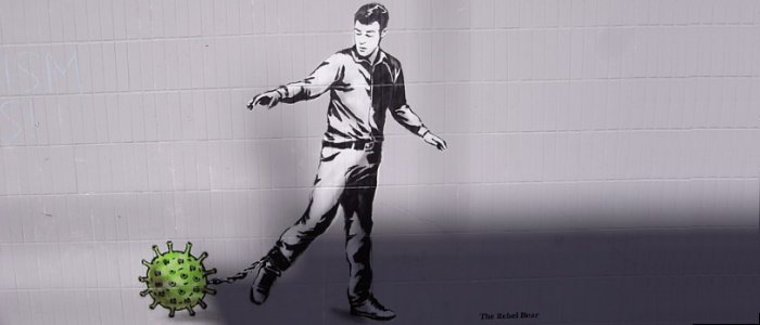 graffiti - man with coronavirus as ball and chain - the rebel bear