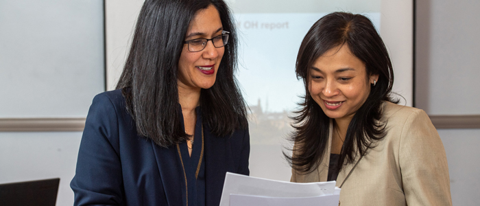 Photo of 2 researchers chatting
