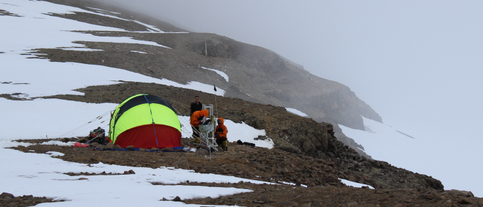 A group of people test drilling equipment in antarctica