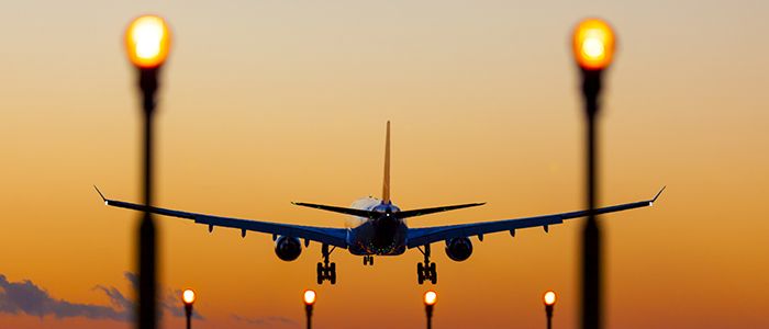 Plane landing into the sunset