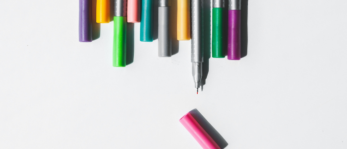 Line of coloured pens in a row
