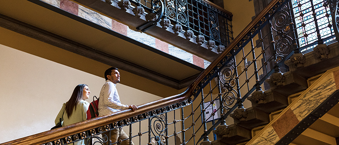 students on campus, climbing the stairs to the Bute Hall