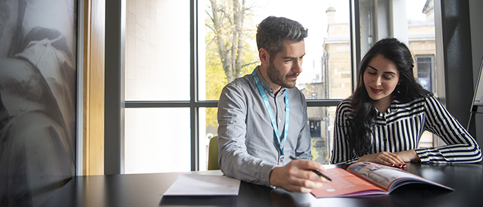 Student meeting with a member of staff in the Fraser Building