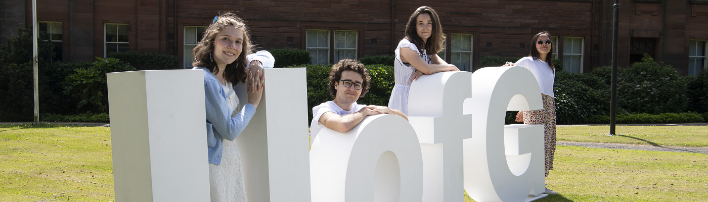 UofG Letters with Students sitting - 1400x400