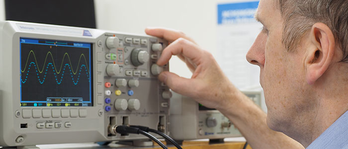 Image of Jim Green working with an oscilloscope