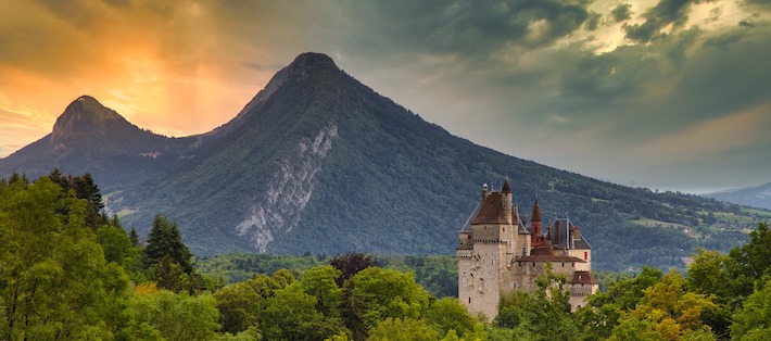 Landscape of mountains with castle in foreground