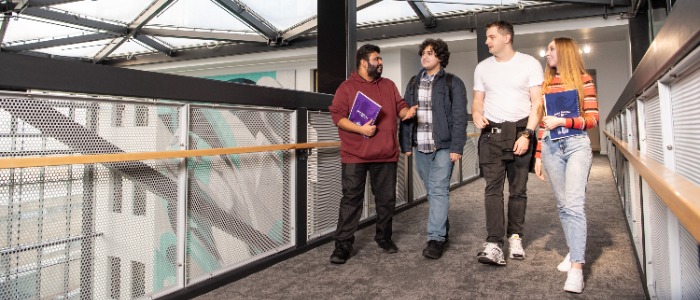 Graduate Apprentices walking in the corridor