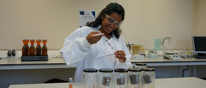 Student in the lab doing an experiment with injection