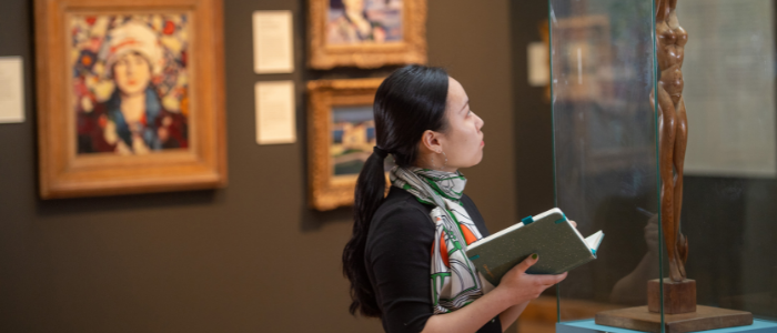 Student looking at art in the Huntarian Gallery