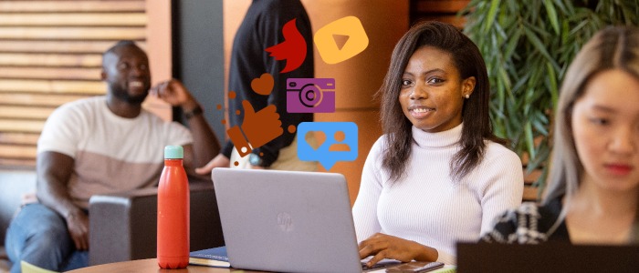 University of glasgow student on laptop with social media icons floating from screen