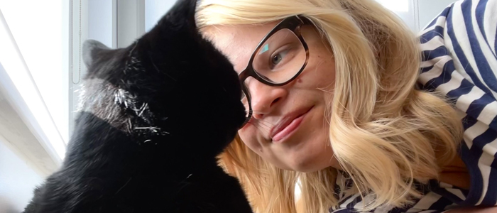 Photo of Enni Miller with her black cat