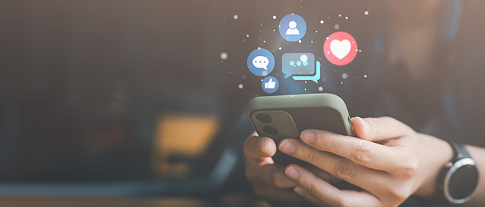 Smartphone lit up with social media icons