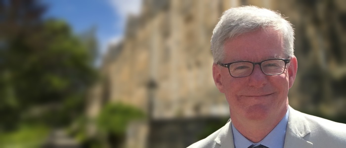 Professor Martin Hendry with blurred Professors walk as background.
