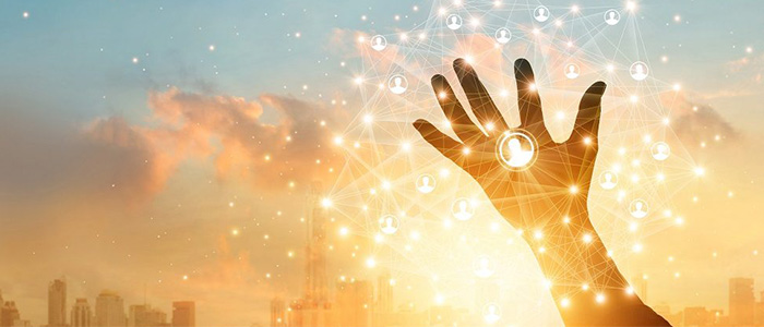 A hand reaching up to the sky with a sunset and city in the background and a representation of a network of people. Image credit: ipopba | iStockphoto https://www.istockphoto.com/photo/businessman-touching-icon-customer-in-hand-with-global-network-connection-and-data-gm1025744866-275130902