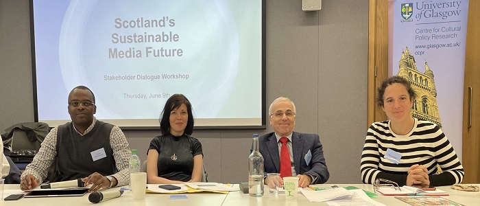 Two females and two males smiling at the camera 