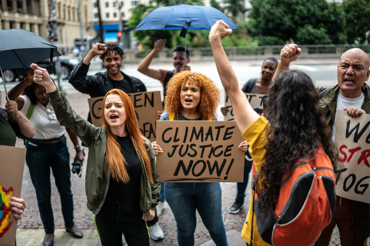 People holding signs during on a demonstration for environmentalism