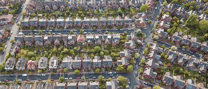 Aerial view of lots of small houses, roads and gardens Source: samuel foster | iStockphoto https://www.istockphoto.com/photo/residential-houses-drone-above-aerial-view-blue-sky-with-park-and-greenery-gm957484092-261450059