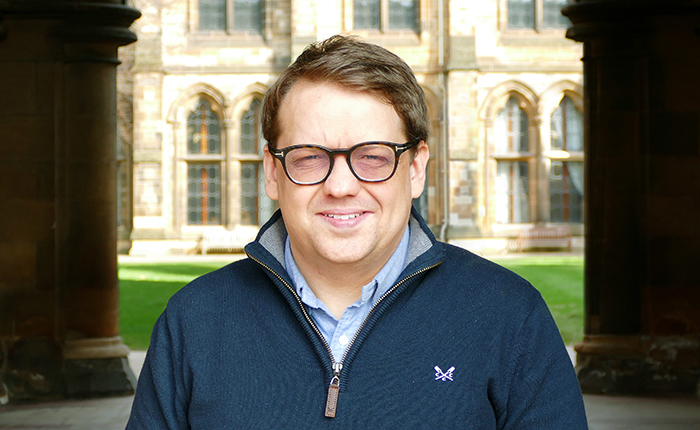 Dr Anthony Devine profile photo in the west quad of the University of Glasgow