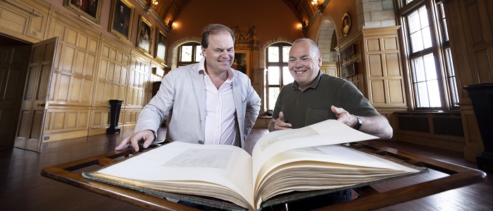 Lord Dalmeny and Professor Gerard Carruthers of the University of Glasgow at Barnbougle Castle looking through the Burnsiana book, now on loan to the University. Photo Credit Martin Shields
