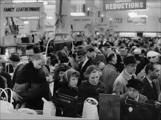 Photograph of customers browsing the sale items during the winter sale, c1960. (GUAS Ref: HF 51/6/1/5/3 photo 1. Copyright reserved.)