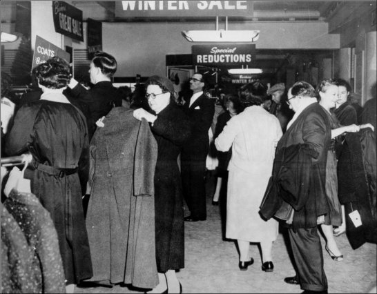 Photograph of customers browsing the sale items during the winter sale, c1957. (GUAS Ref: HF 51/6/1/5/1. Copyright reserved.)