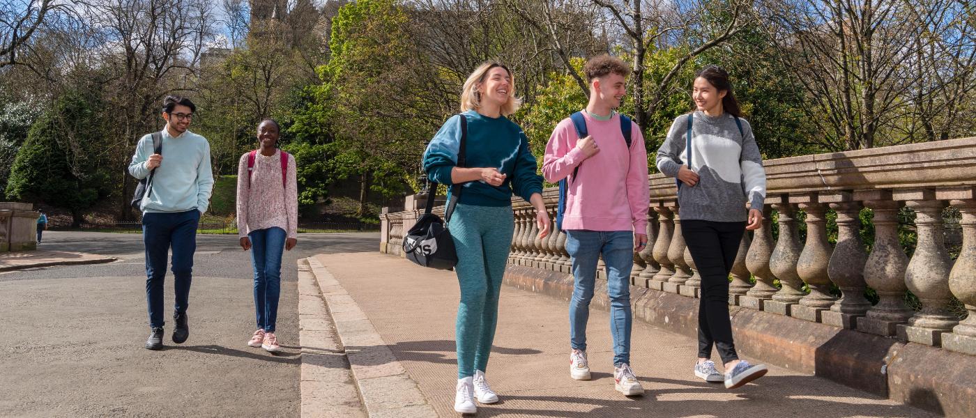 Students walking across bridge in Kelvingrove Park