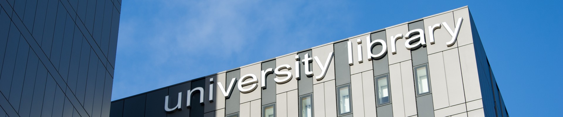 Library building against a blue sky