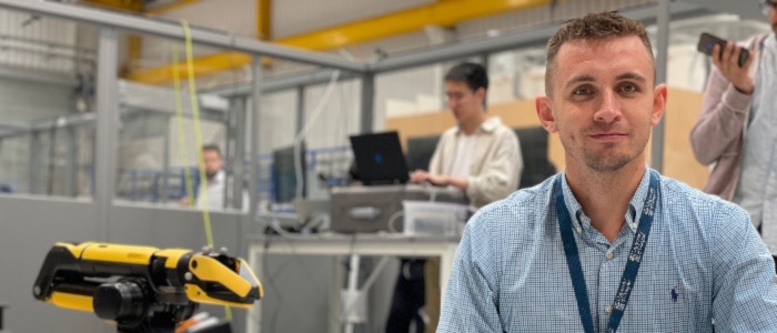 Image of man in a blue shirt in a lab
