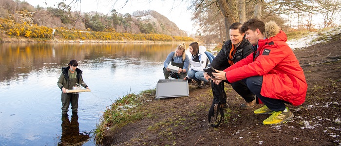 Students on field trip at river