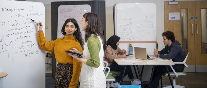 Mathematics students at a whiteboard